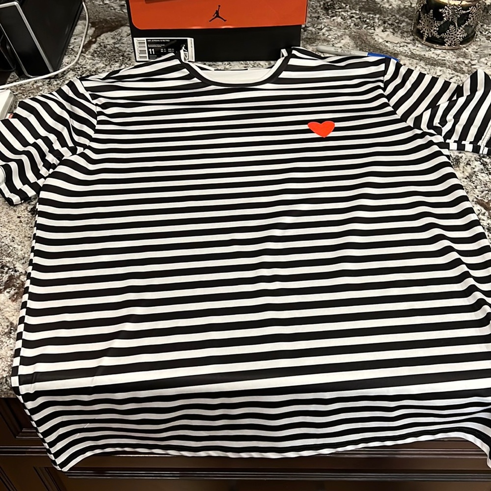 Black and white striped shirt with a red heart